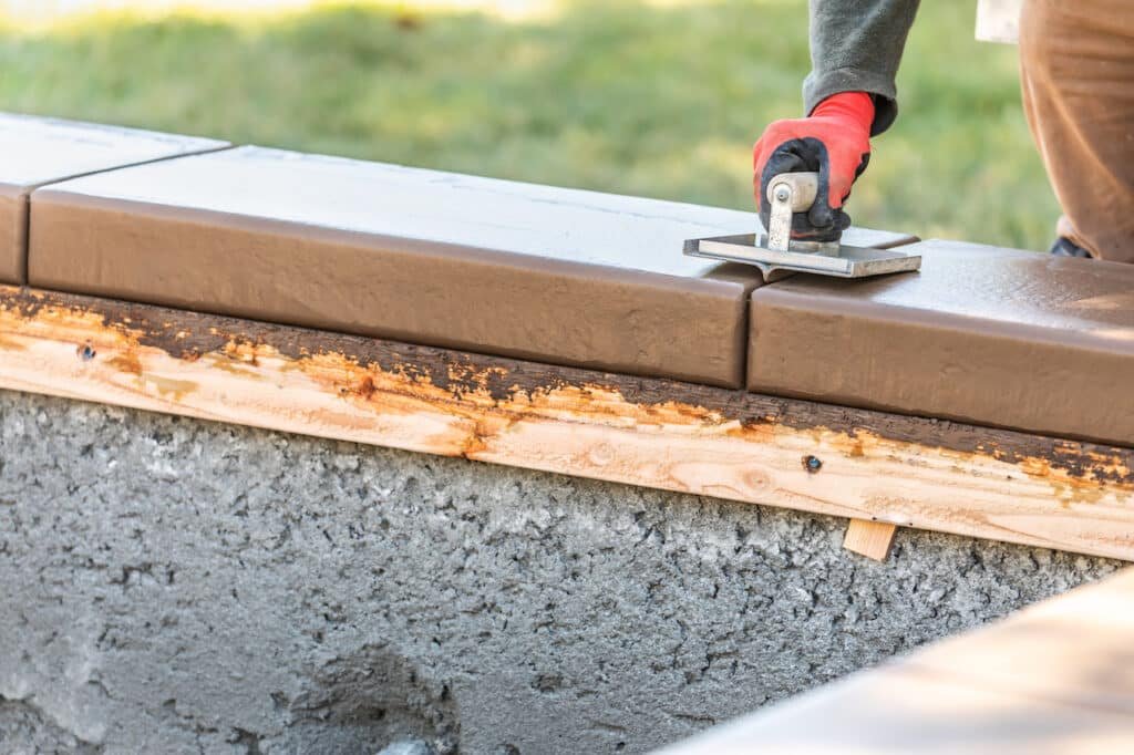 When is the Best Season to Invest in a Pool? 1 pool builder during pool installation process