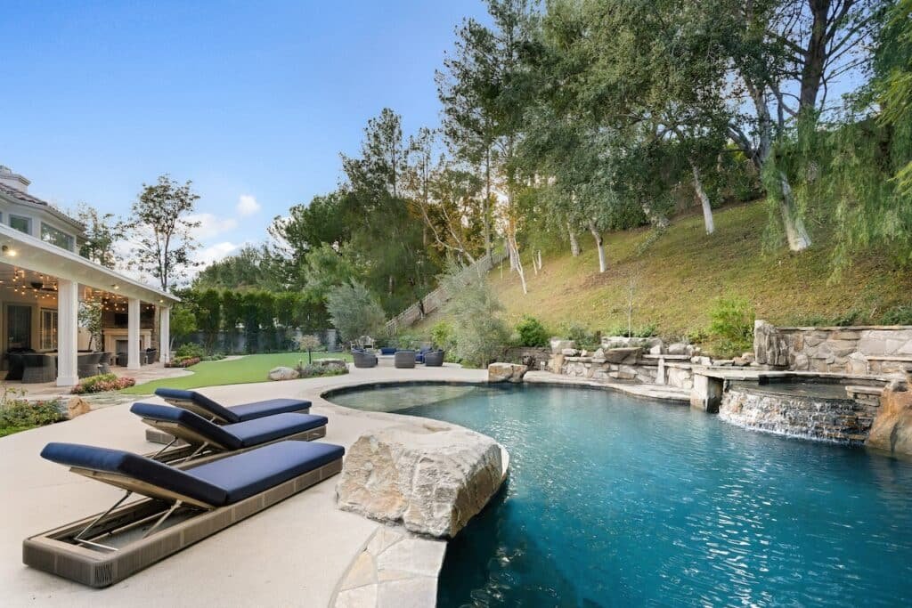 Building Your Dream Pool on Uneven Terrain: Tips for a Sloped Backyard 9 backyard pool next to hill